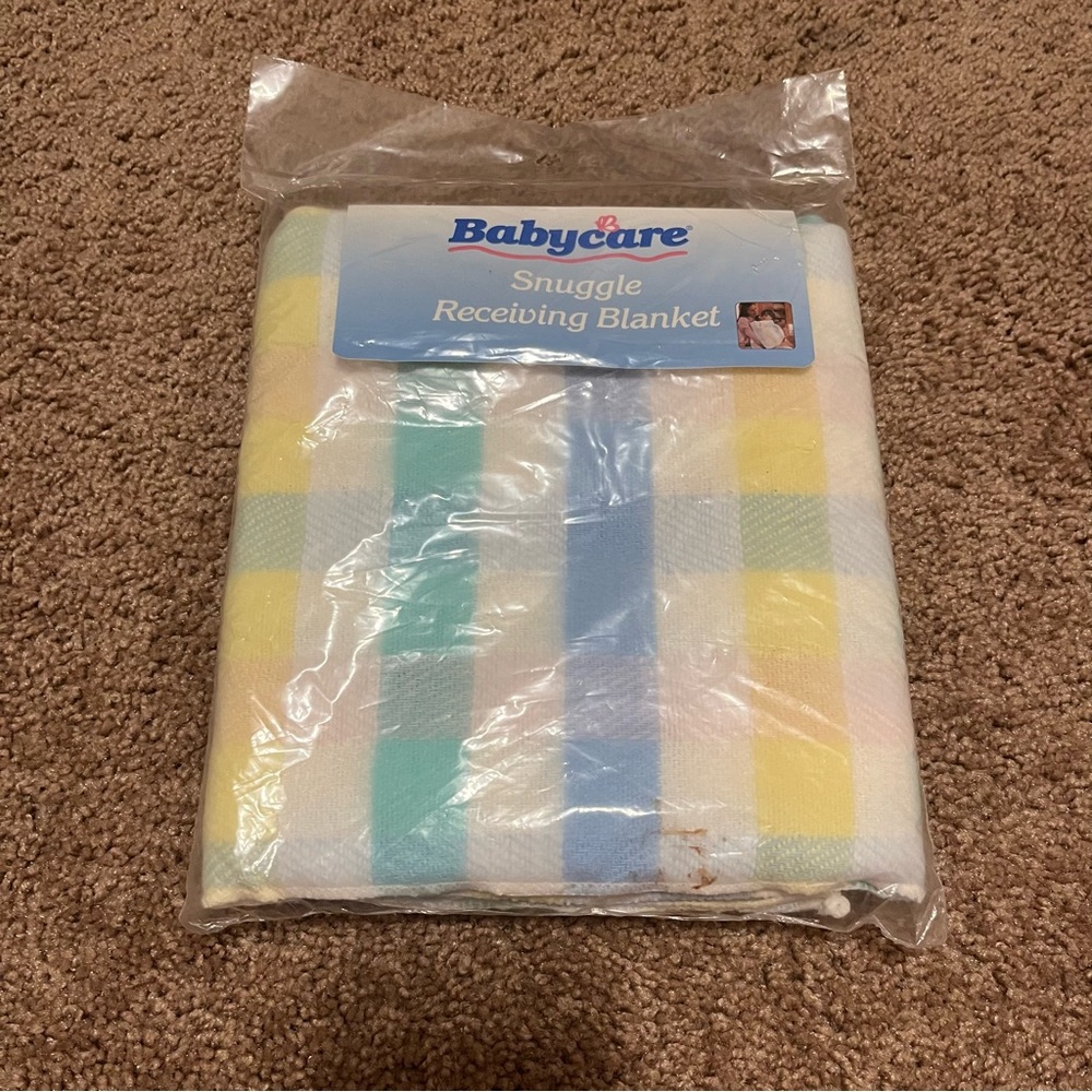 NWT White, green, yellow, blue, and pink Babycare snuggle receiving blanket